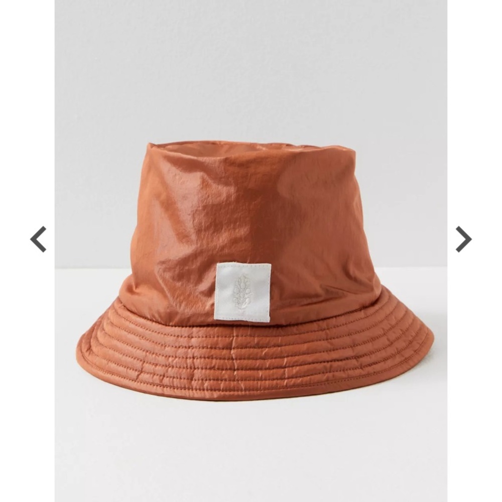Free people’s Sherpa lined, water resistant reversible bucket hat.